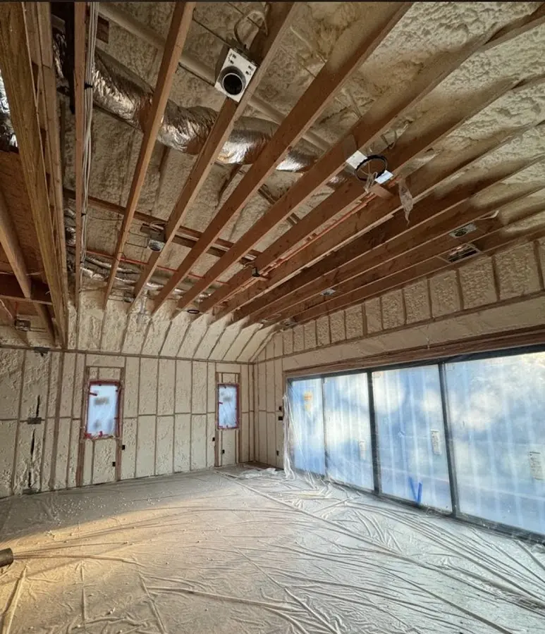 Interior walls and ceiling insulated with spray foam during new construction in Auburn Hills